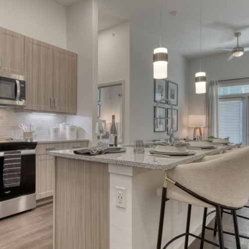 a kitchen with a marble island