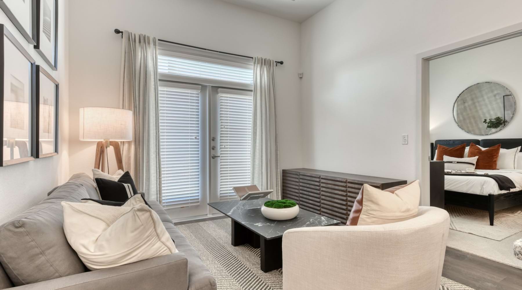a living room with a large mirror