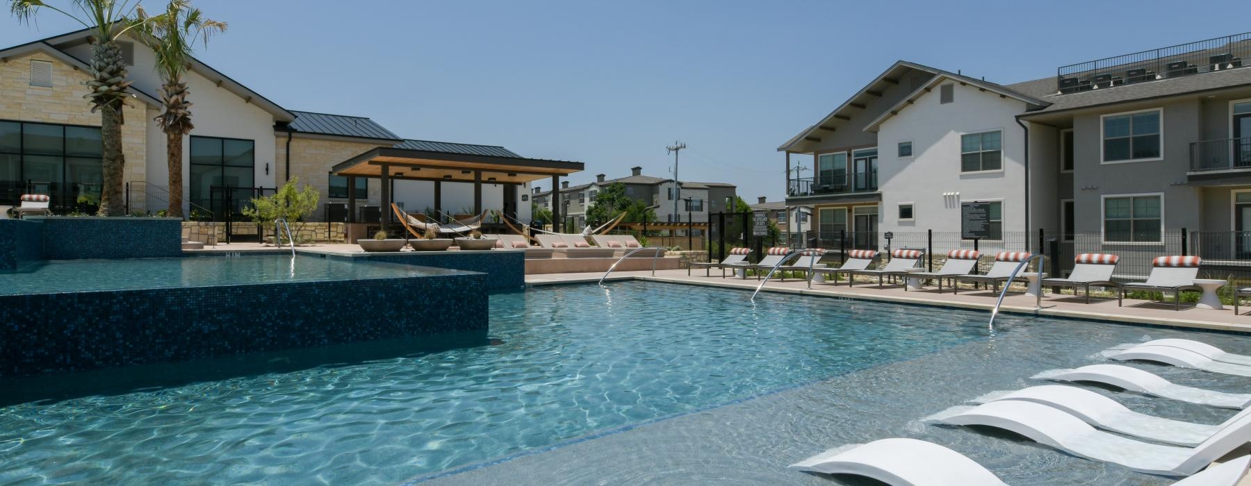 a pool with chairs around it