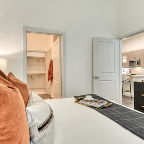 a bedroom with a bed and a desk